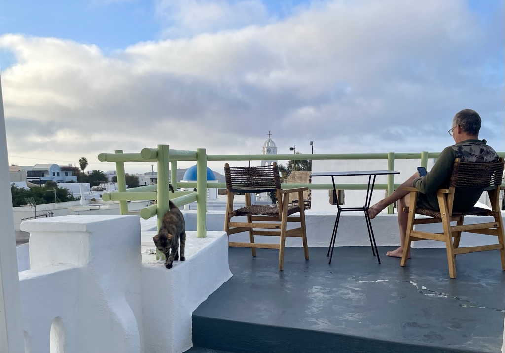Chris and our cat have morning coffee.