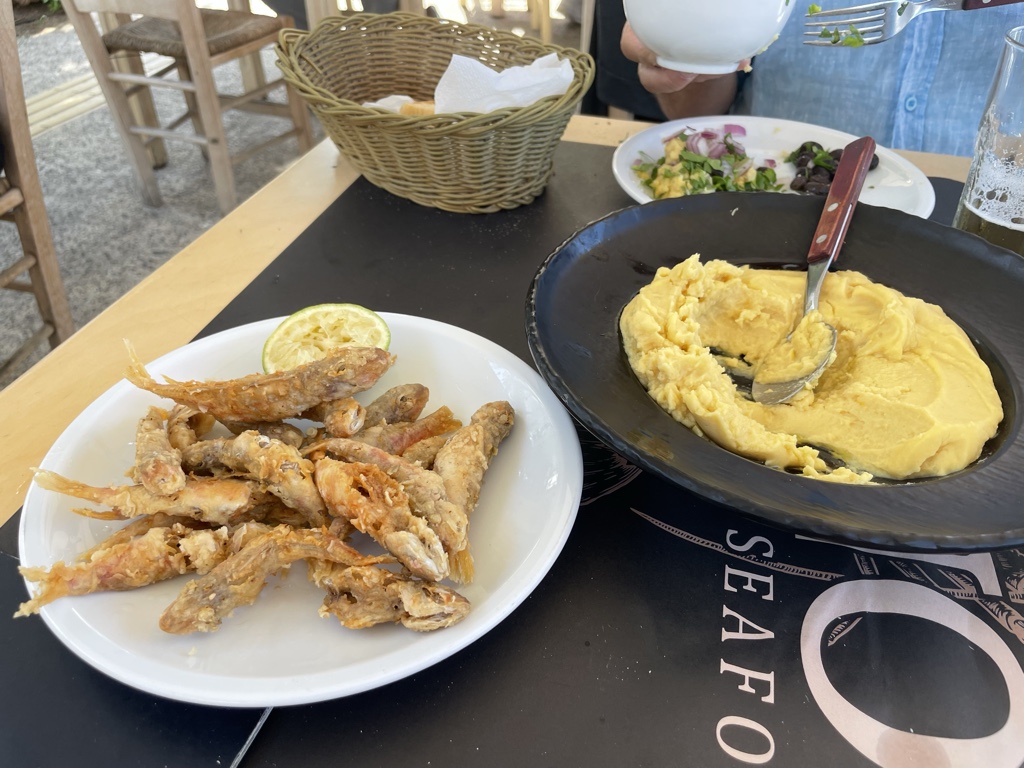 A half-portion of barbouni along with split pea puree.