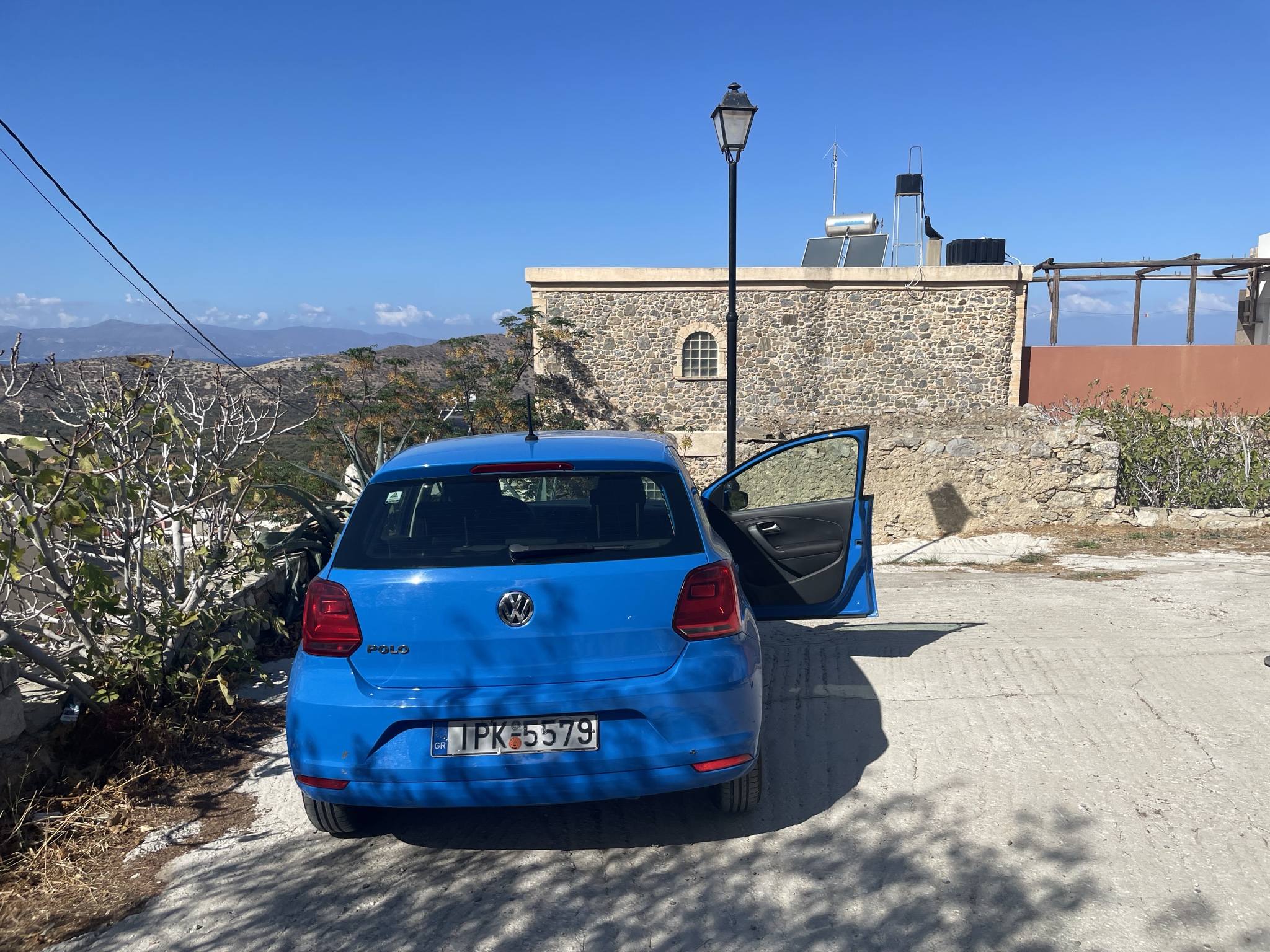 Our fun blue Polo parked by our house in Kavousi!