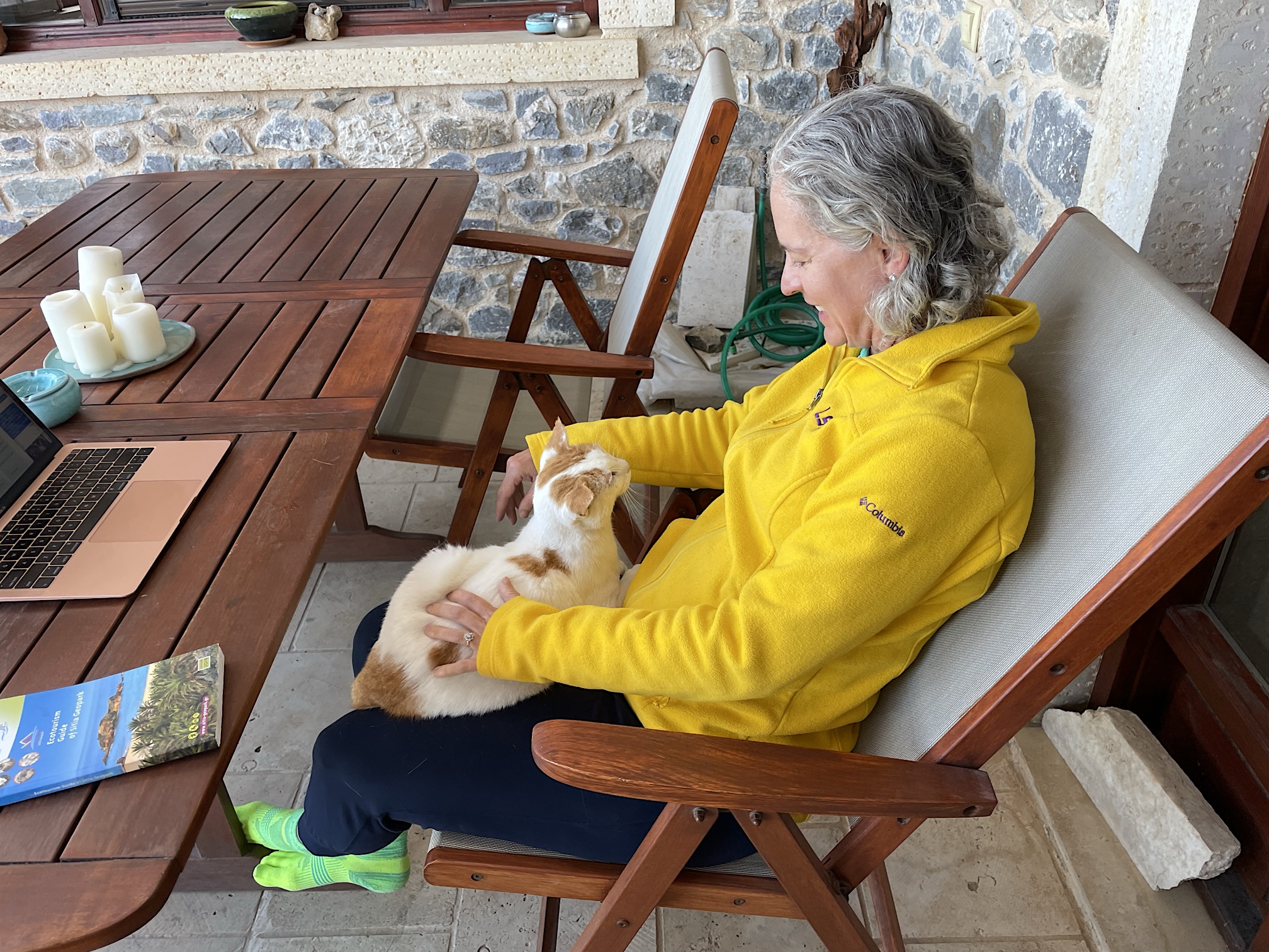Amy on our porch with cat.