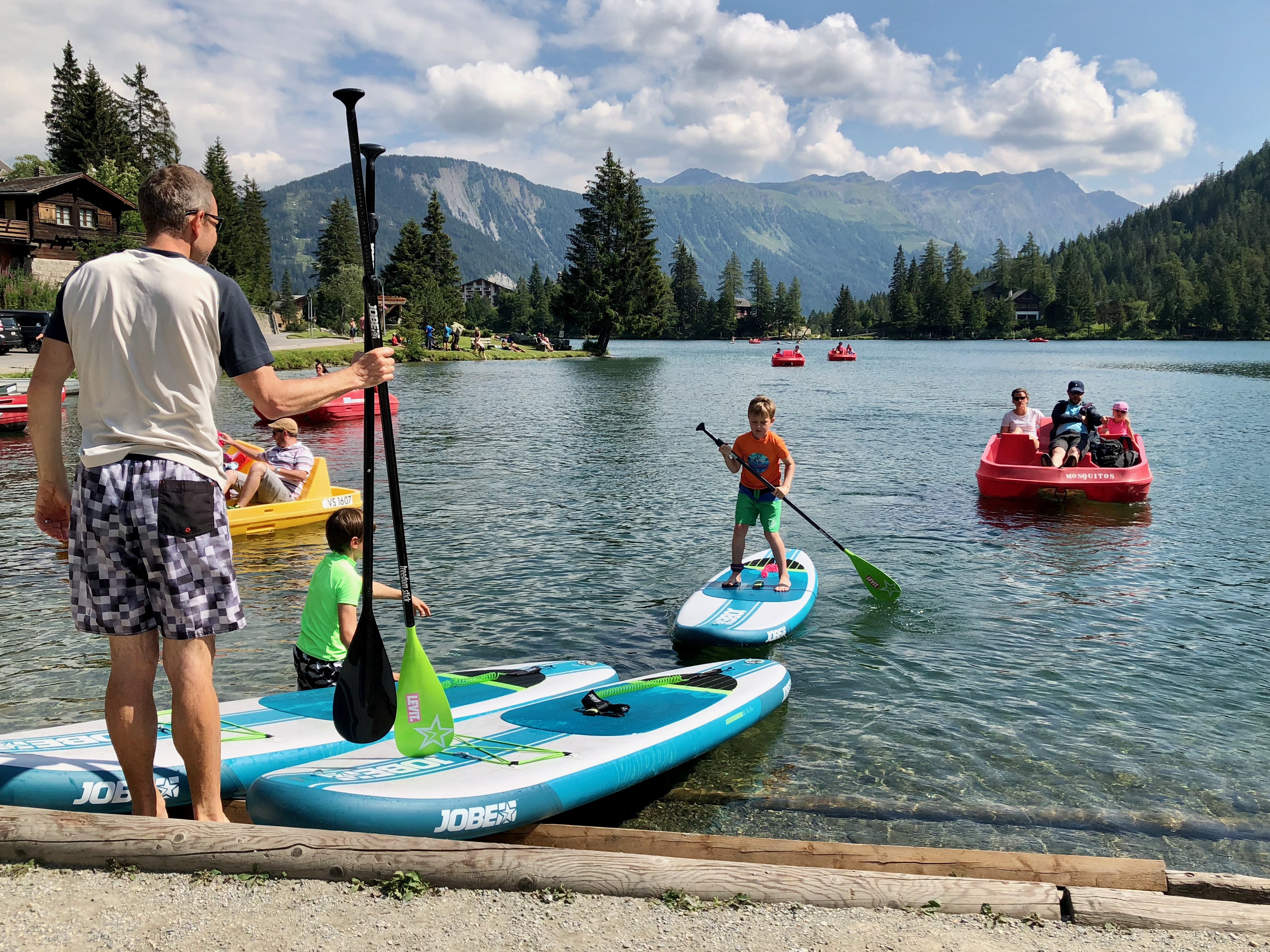 Tourists enjoying the lake portion of Champex-Lac.