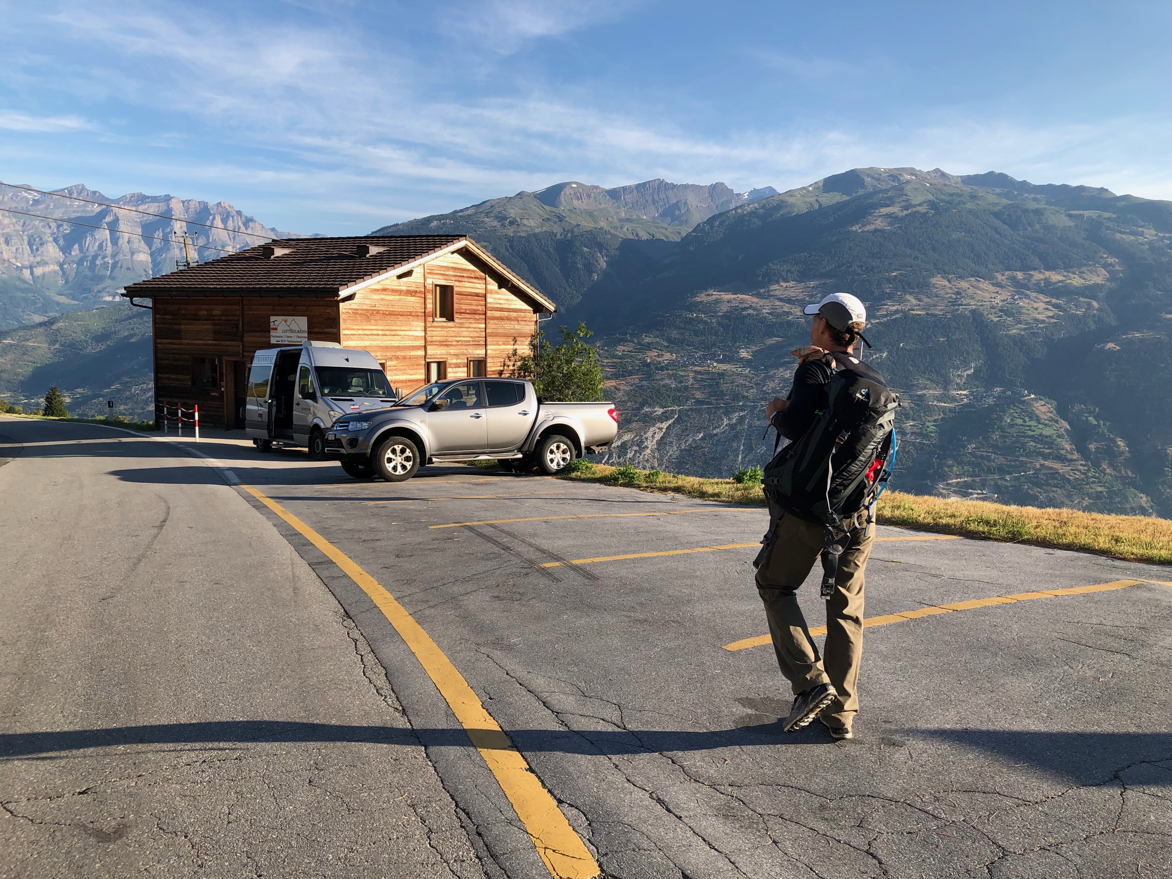 The van waits for passengers to arrive from the valley (from Leuk?) on the cablecar.