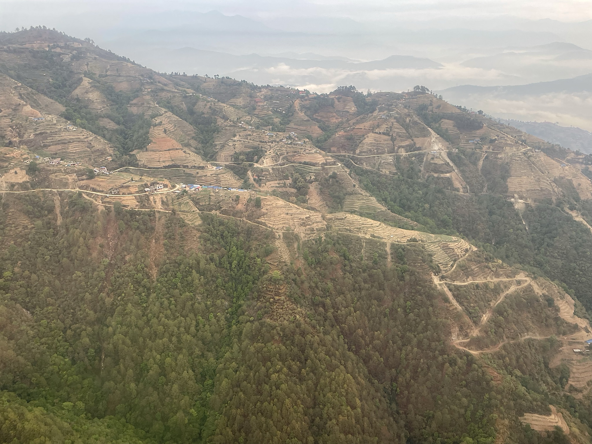 We flew close enough to see the dirt roads and paths crisscrossing the hillsides.