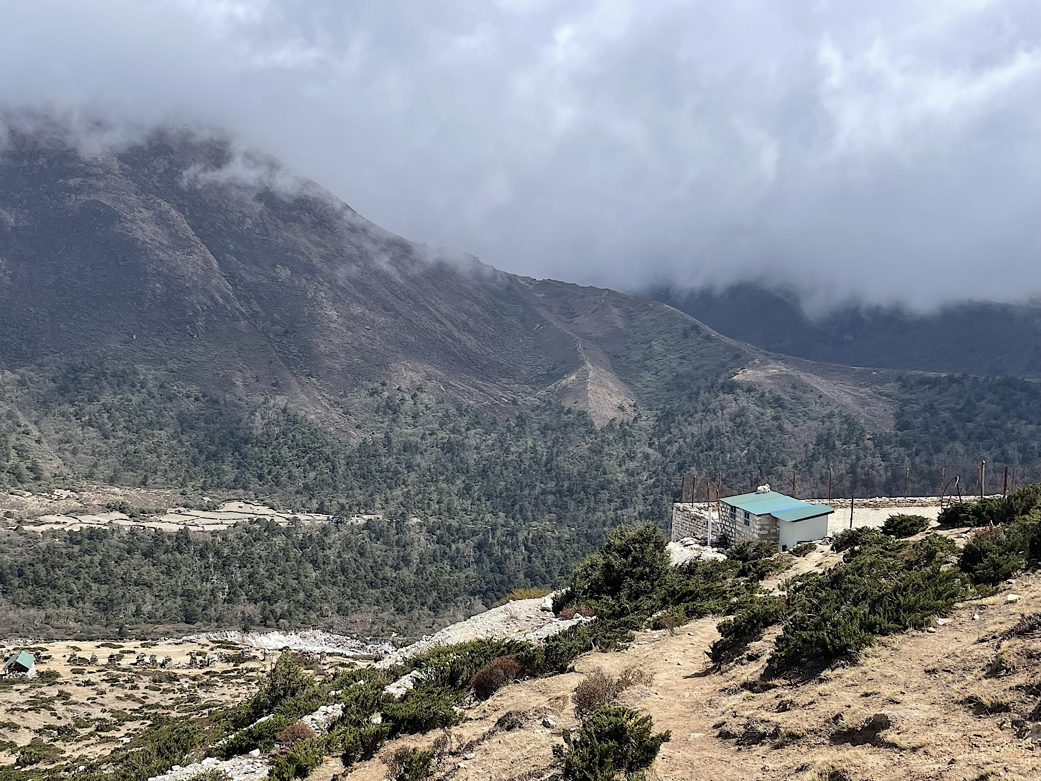 I visited the toilets in a hillside schoolyard, which involved climbing through a fence and down a stone wall and back up again.