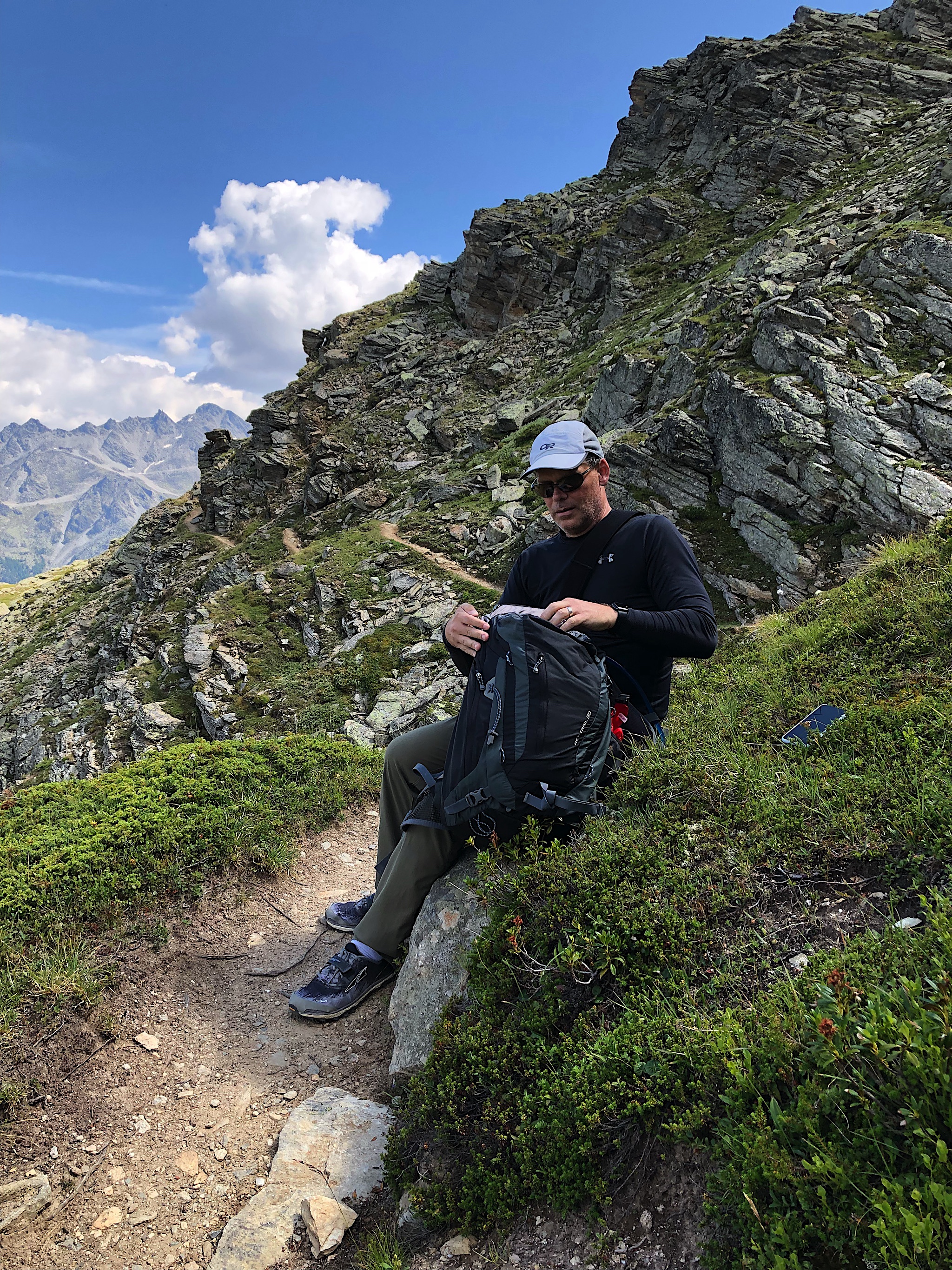 Chris did that whole trail in Switzerland with his right arm in a sling. This is him stopping to take his meds right before the scary bit, which you can see behind him. That Swiss trail was WAAAY scarier than anything we saw in Nepal!